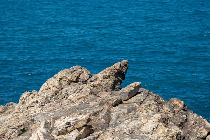 A tranquil view of a rocky coastline with blue Mediterranean Sea in Istanbul, Turkey.