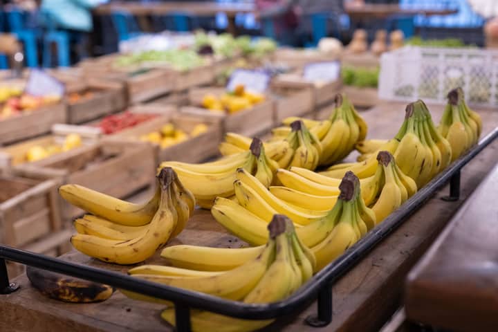 Vibrant display of bananas at a bustling market in Santiago, Chile.