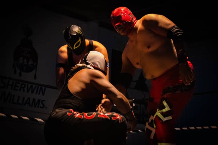 Masked wrestlers perform during an intense lucha libre match in León, Mexico.