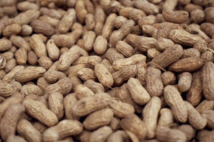 Abundance of raw peanuts in shells. Great for backgrounds or agricultural themes.