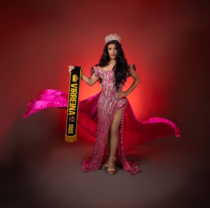 Glamorous pageant winner in shimmering gown and crown holding a banner.