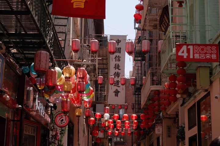 Colorful lanterns hang above a Chinatown alley in San Francisco.