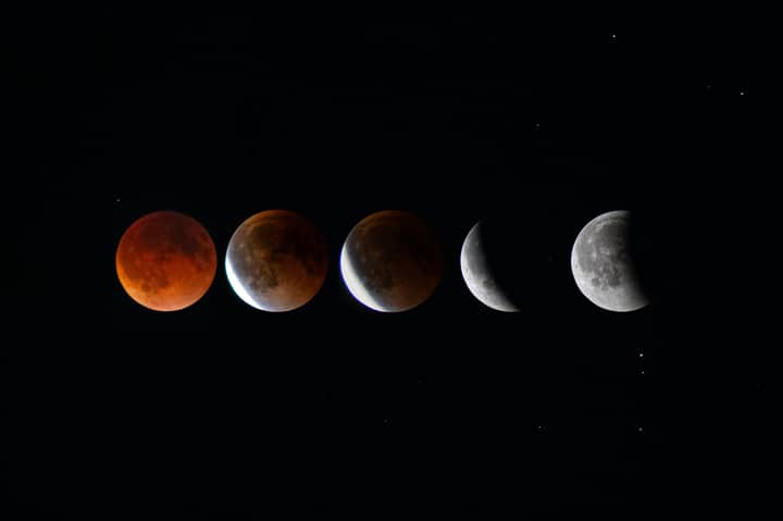 Phases of a lunar eclipse showcased against a starry night sky, highlighting the celestial event.
