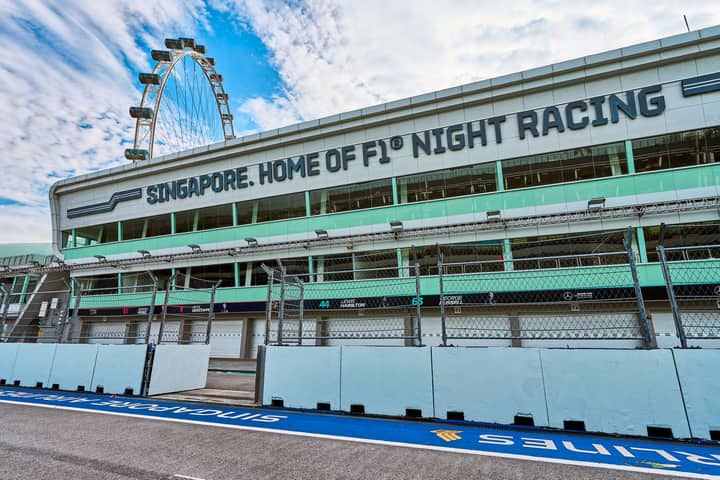 Empty Singapore Grand Prix F1 circuit during the day, showcasing race track and Singapore Flyer.