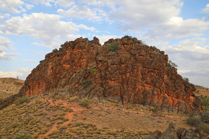 Explore the dramatic rock formations of Australia's Northern Territory under a vibrant sky.