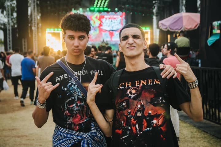 Two young adults enjoying a lively music festival in Casablanca, Morocco.
