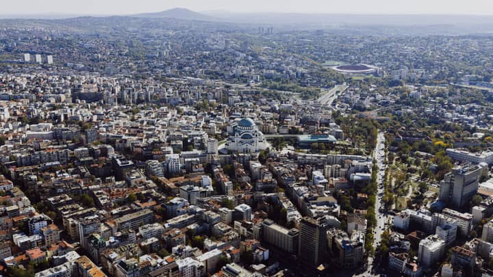 Aerial shot of Belgrade cityscape featuring the iconic St. Sava Temple, Serbia.