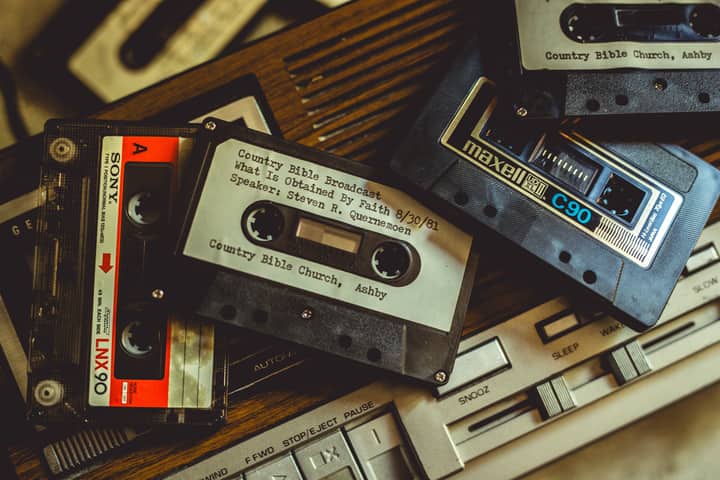 Collection of vintage cassette tapes and player, evoking nostalgia and retro vibes.