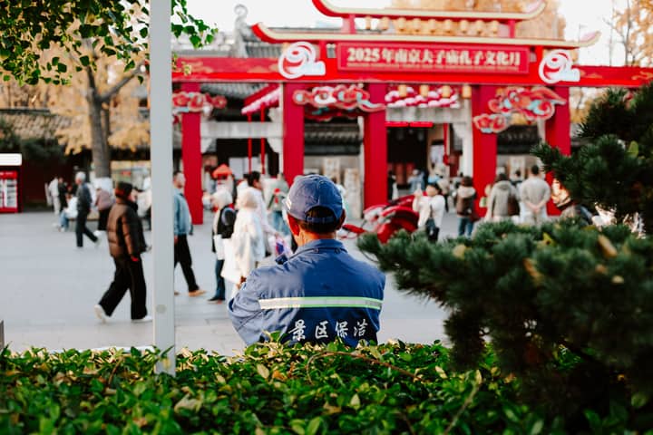 Vibrant street scene in Nanjing, China captures daily life and cultural elements during autumn.