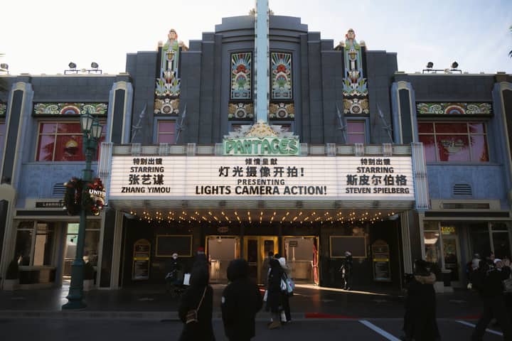 Art deco theater in Universal Studios Beijing with festive decorations and vintage marquee.