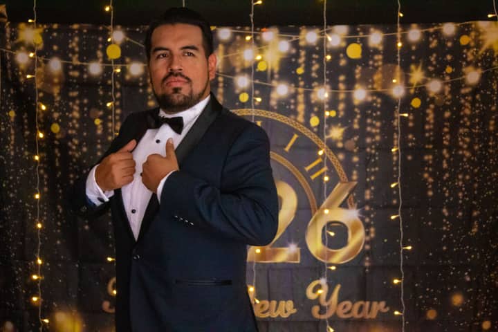A sophisticated portrait of a man in a tuxedo celebrating New Year's Eve in Mexico City.