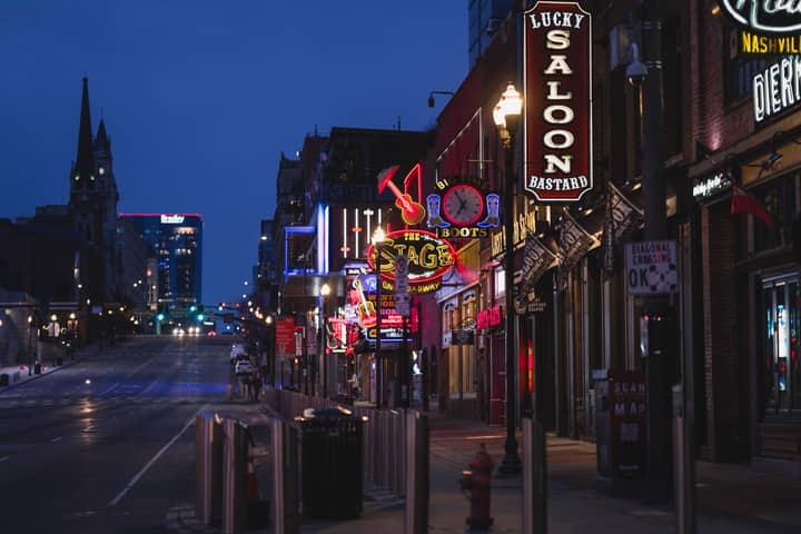 Explore neon-lit Nashville's Broadway street, a hub for nightlife and iconic bars.