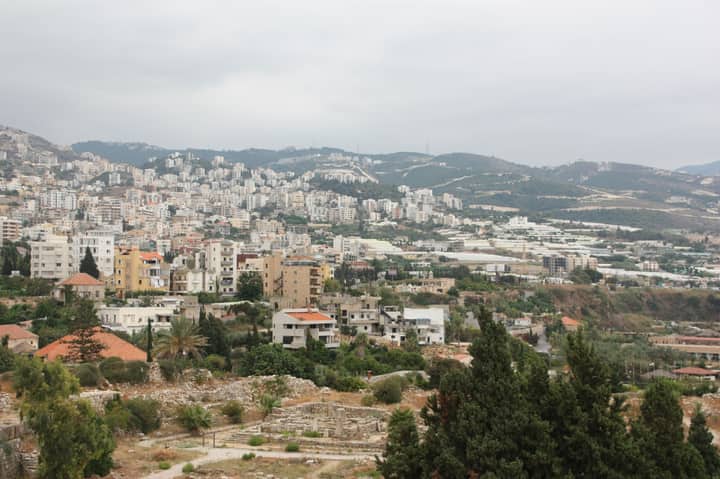 Hillside view of Byblos showcasing urban cityscape and natural landscape in Lebanon.
