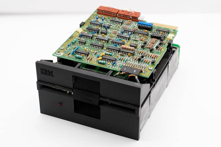 Close-up of a vintage IBM circuit board showcasing electronic components and retro technology.