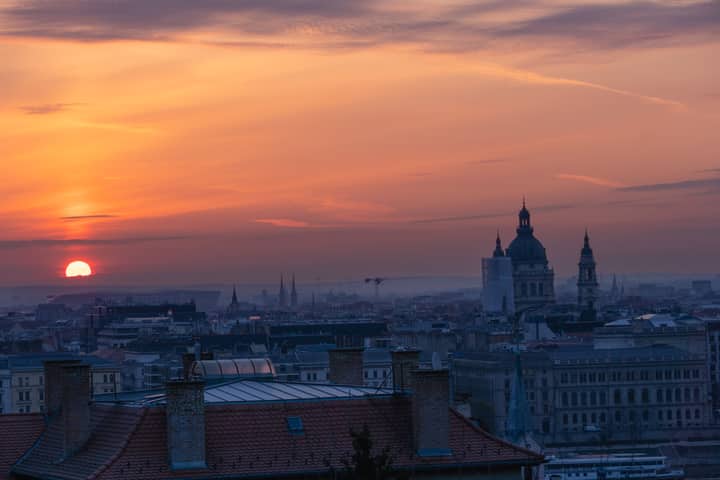 Captivating sunrise over Budapest skyline featuring St. Stephen's Basilica.