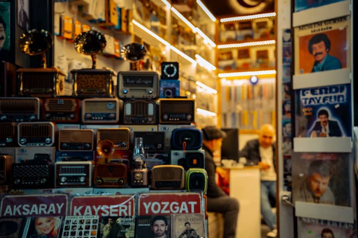 A cozy vintage store filled with retro radios and records, exuding a nostalgic atmosphere.