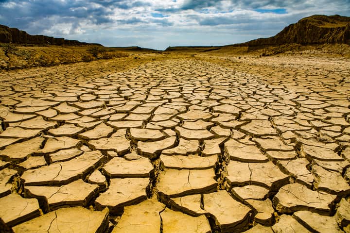 Dramatic view of cracked dry earth in Maracaibo, Venezuela, depicting climate change and drought effects.