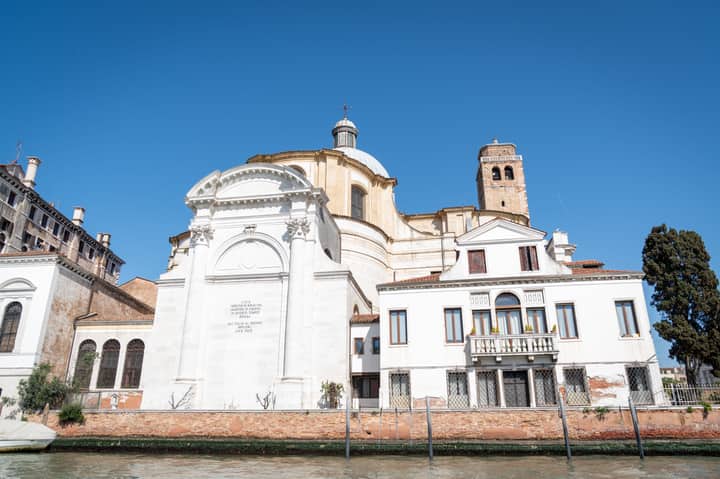 Beautiful historic buildings by the canal in Venice, showcasing unique Venetian architecture.