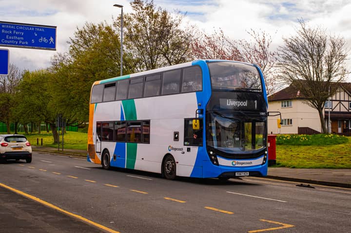 Stagecoach double-decker bus in Liverpool on a sunny day, showcasing urban transport.