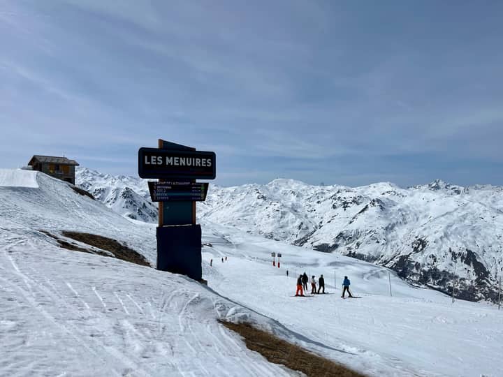 Scenic view of skiers at Les Menuires, a popular ski resort in the French Alps, during winter.
