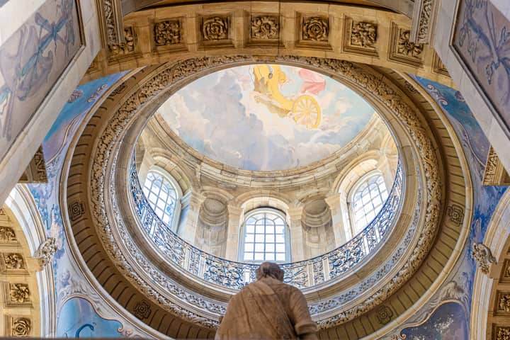 The intricate dome interior of Castle Howard, showcasing stunning architecture and art under natural light.