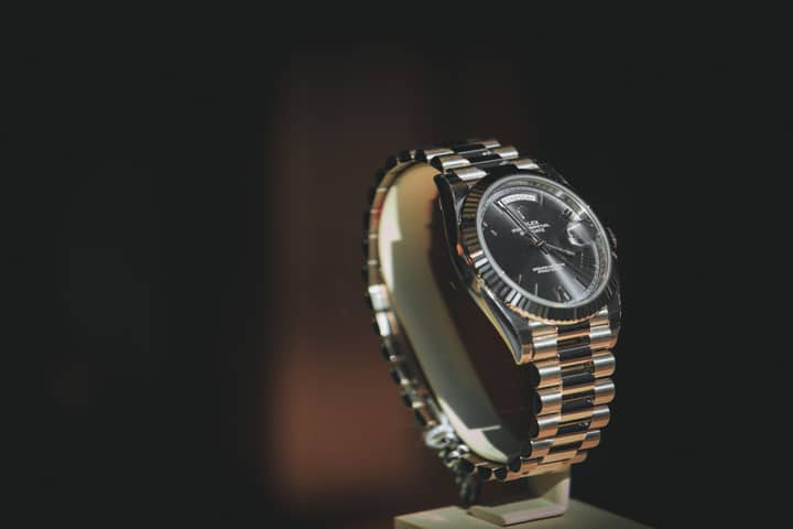A close-up shot of a luxury watch with a metallic bracelet, showcasing elegance and precision.