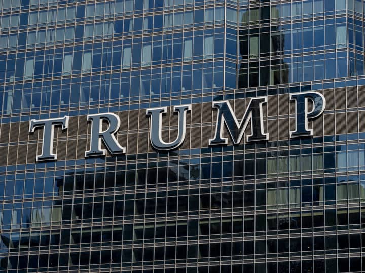 Detailed facade view of the Trump building with reflective glass windows.