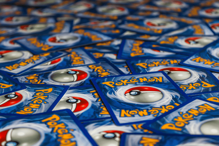 A vibrant display of Pokémon trading cards featuring the iconic Pokeball design.