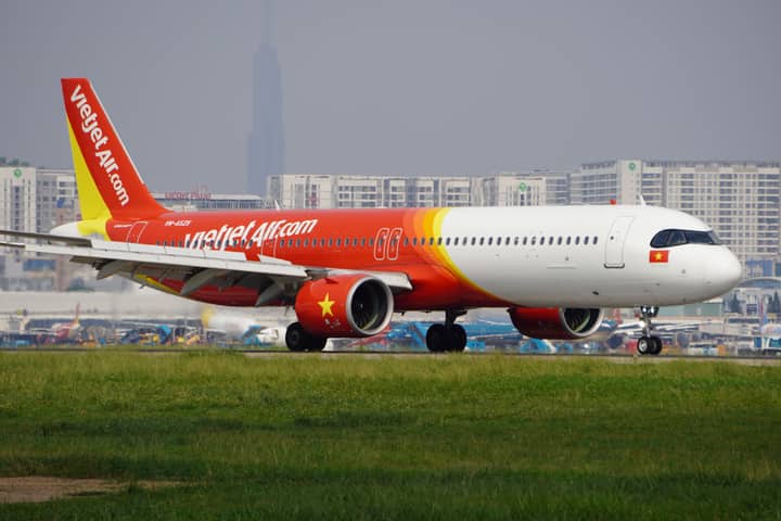 A VietJet Air Airbus A321 aircraft is taxiing on the runway at an airport.
