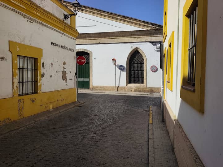 Explore the rustic charm of narrow streets in El Puerto de Santa María, Spain.