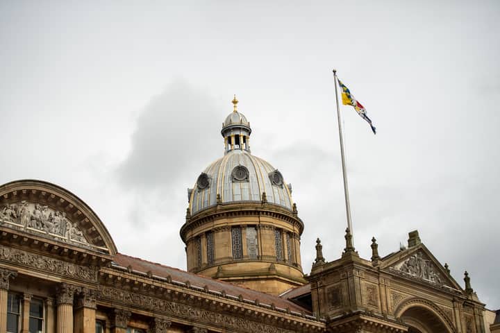 The historic architecture of Birmingham Council House with its iconic dome and flag.