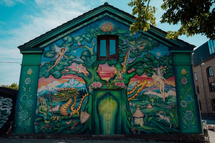 Colorful mural on a house facade in Christiania, Copenhagen, Denmark.