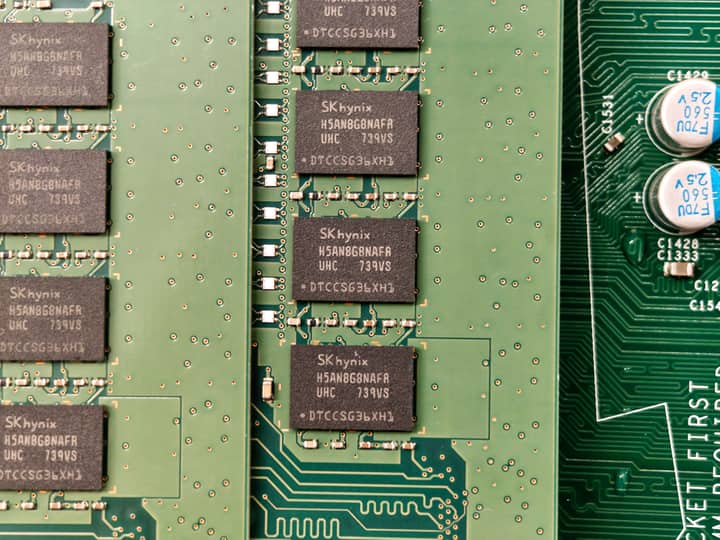 Detailed view of a green circuit board with SK hynix chips, showcasing electronic components.