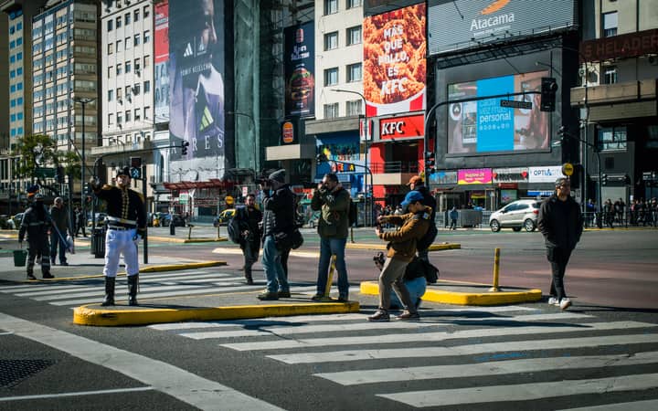 Street musicians play in a lively Buenos Aires intersection, capturing urban energy.