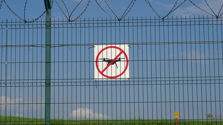 A 'No Drones' sign on a barbed wire fence in Morawica, Poland.