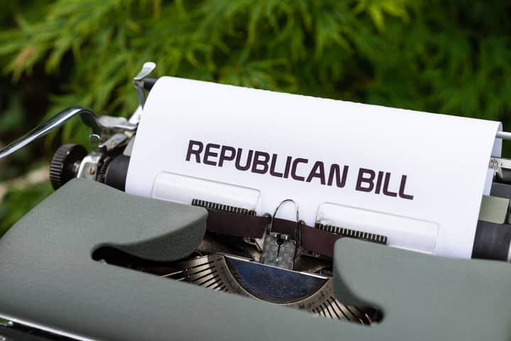Typewriter displaying 'Republican Bill' in an outdoor setting.