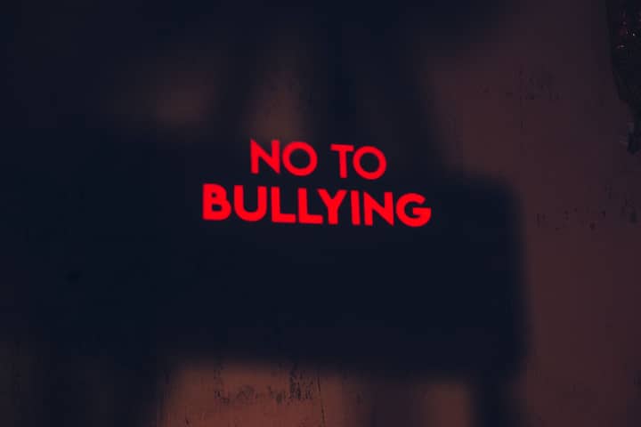A compelling image with the message 'No to Bullying' in bold red text on a dark background.