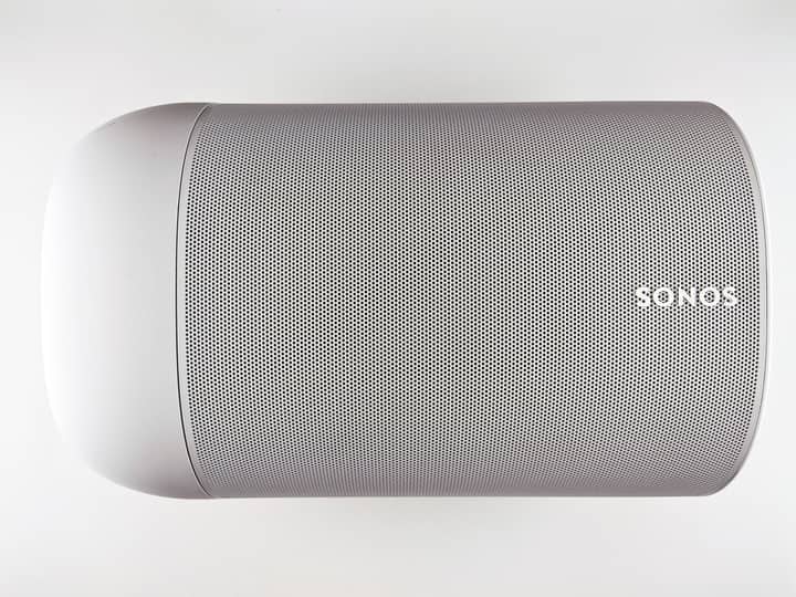 Top view of a sleek wireless speaker with a minimalistic design.