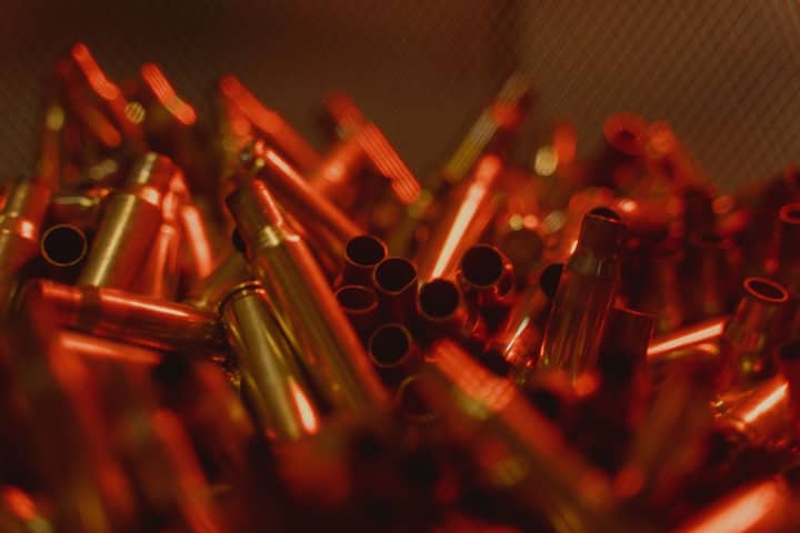 Stunning close-up of glowing copper bullet casings with a selective focus effect.