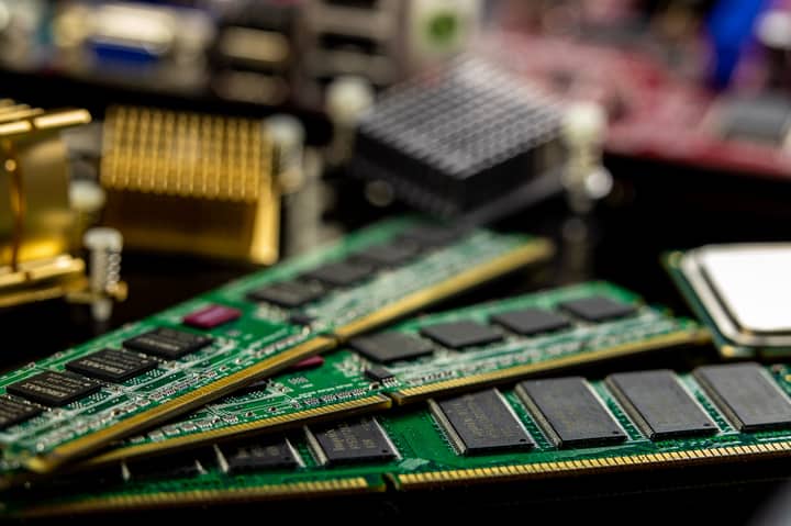 Detailed view of RAM sticks and microprocessors on a motherboard.