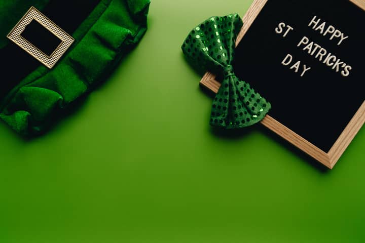 Celebrate St. Patrick's Day with a vibrant display featuring a green bow and festive sign.