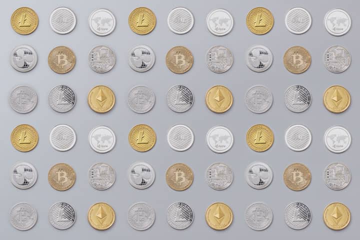A seamless pattern of various cryptocurrency coins in gold and silver tones.