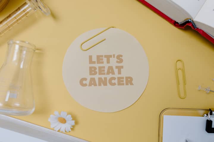 Flat lay with "Let's Beat Cancer" message, encouraging medical and inspirational themes.