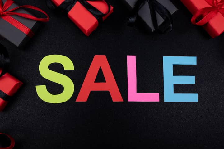 Vibrant SALE text surrounded by gift boxes offers perfect promotional imagery.