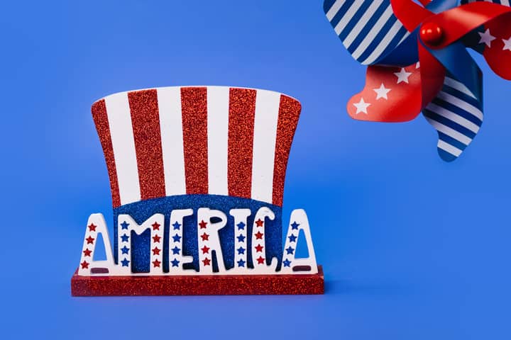Red, white, and blue America-themed decor featuring stars and stripes on a vibrant blue background.