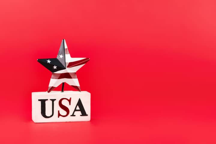 American flag-themed star decoration with USA text on bright red background.