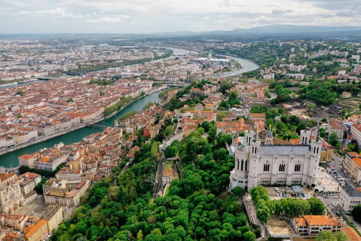 A stunning aerial view of Lyon showcasing the Basilica of Notre Dame and the city's vibrant landscape.
