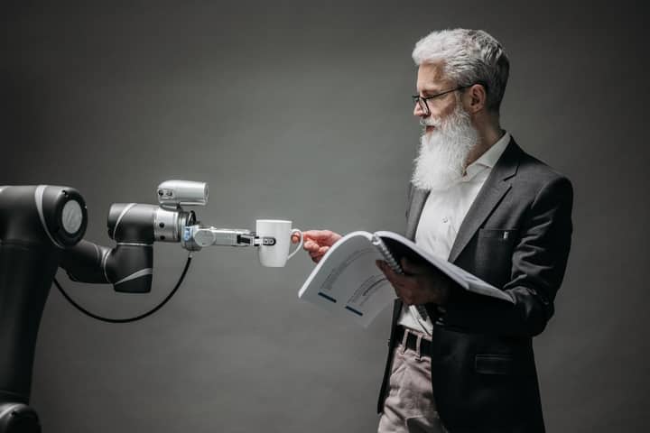 A scientist interacts with a robot helper, demonstrating modern technological innovation.