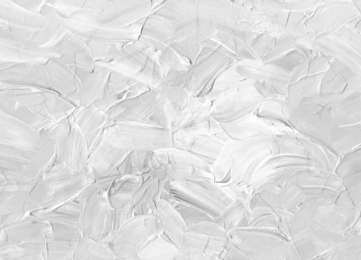 Close-up of textured white abstract paint strokes, modern art.
