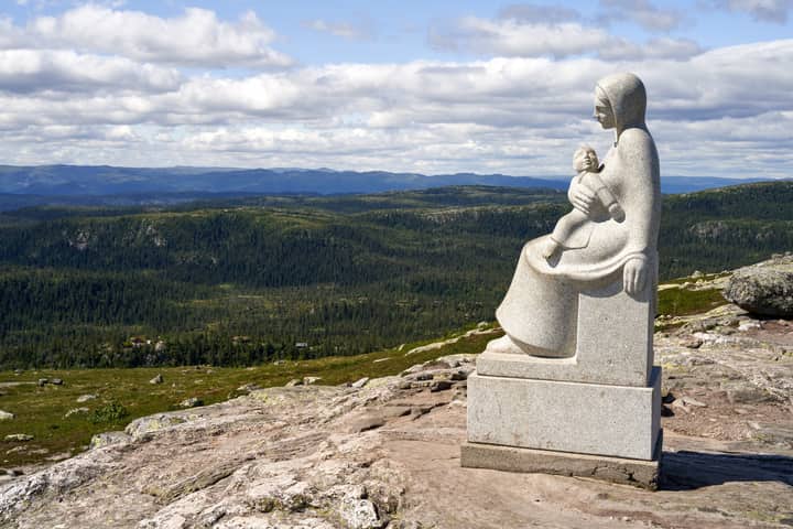 Granite statue of Madonna with Child overlooking the vast Trillemarka landscape in Norway.